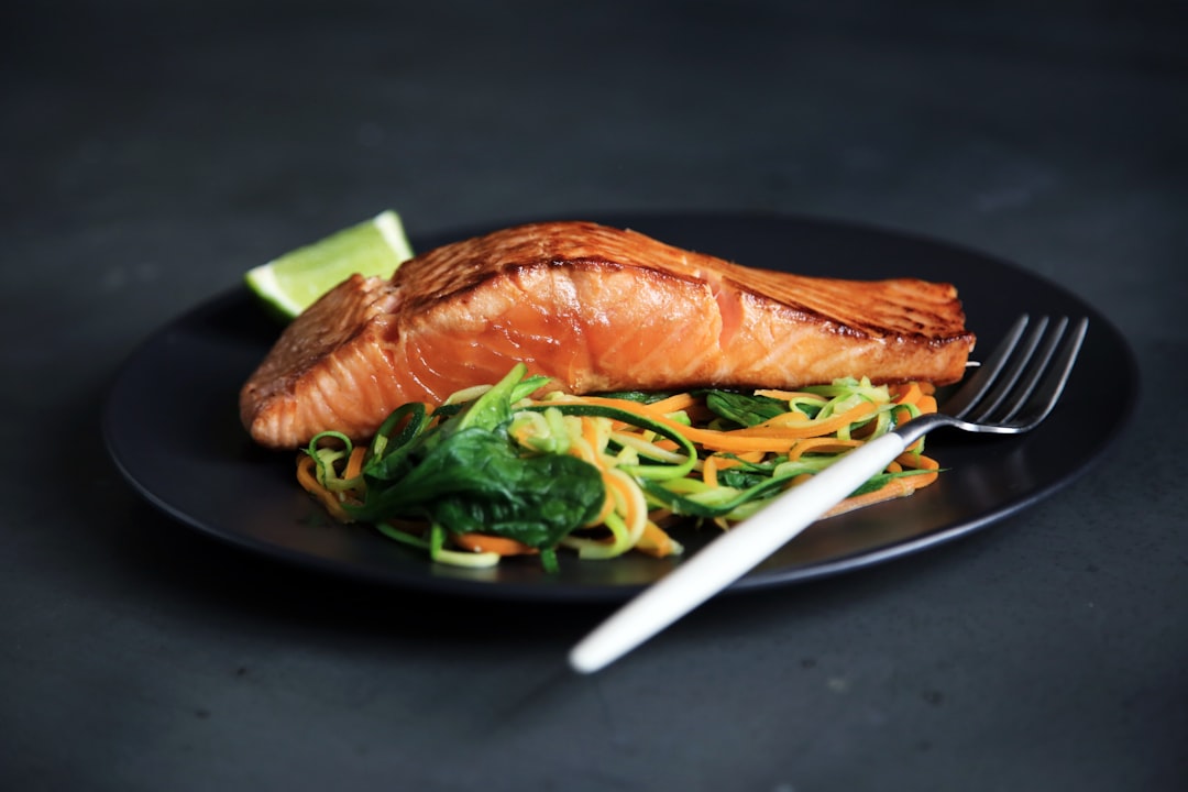 Fresh whole fish being prepared for filleting on a clean cutting board