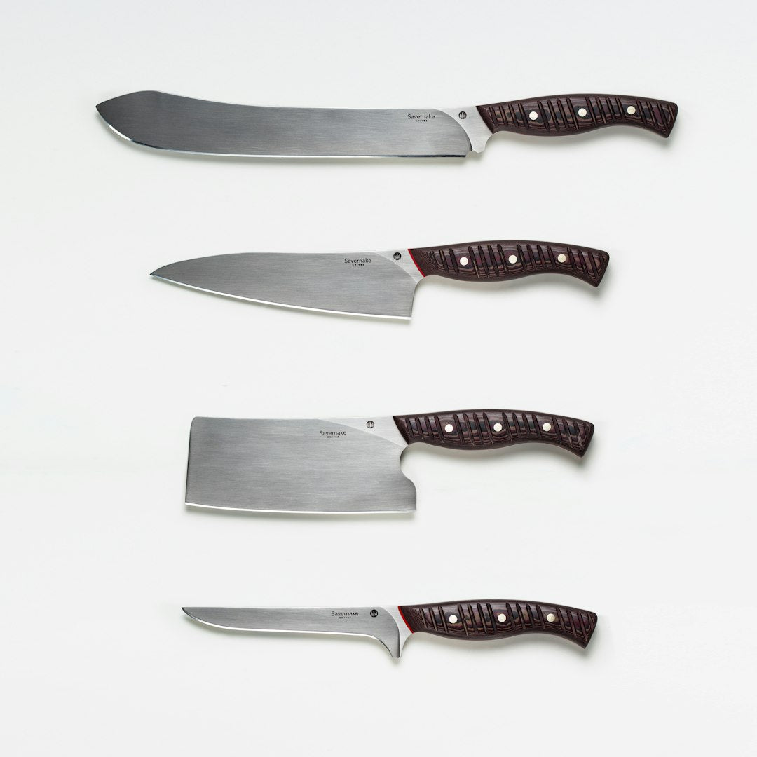 Collection of Japanese knives in various blade lengths on display