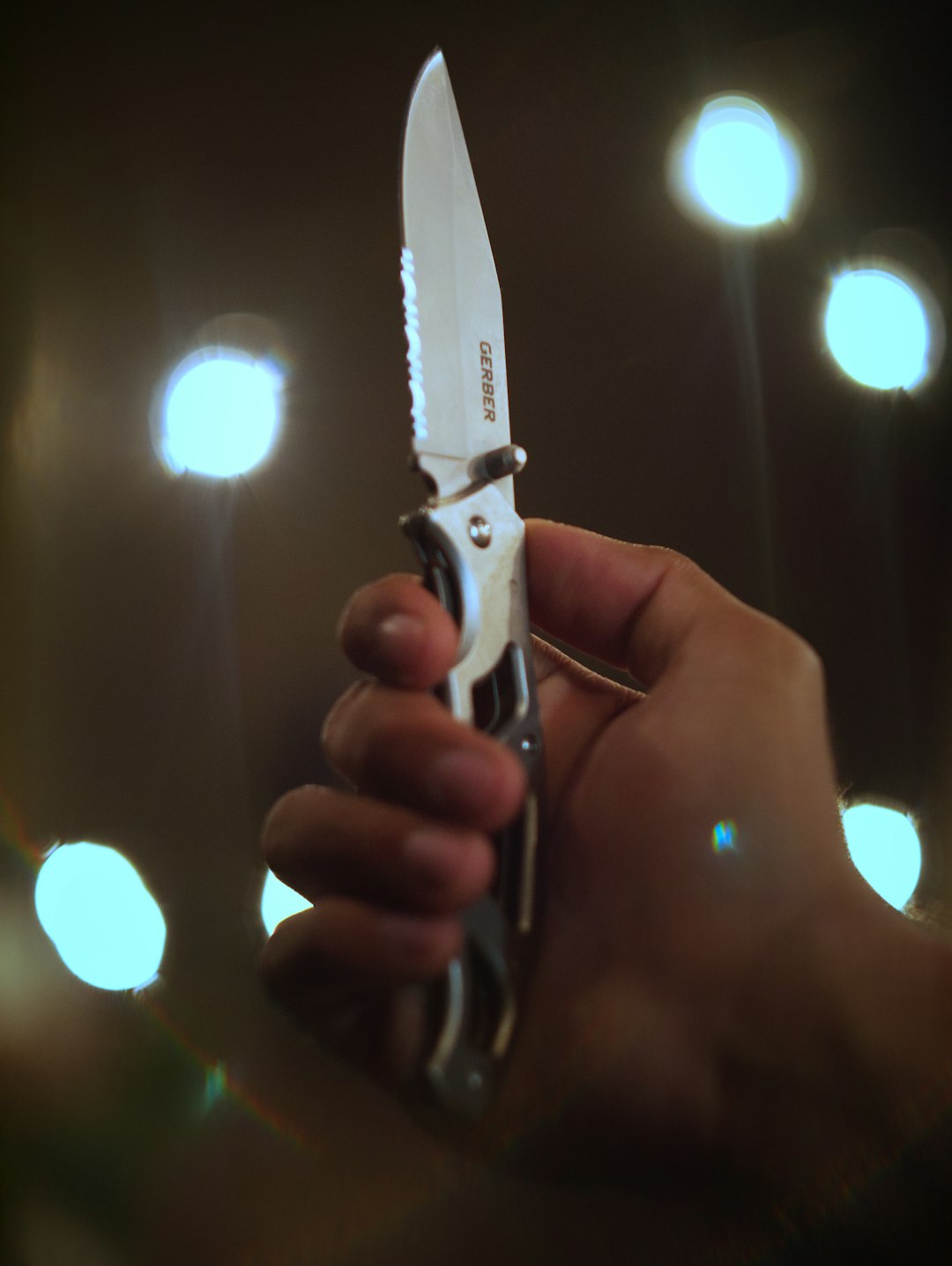 Santoku knife cutting fresh vegetables on a wooden board