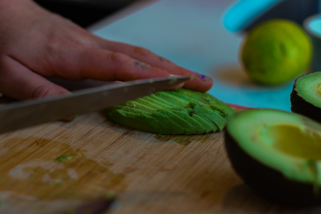Perfectly cut avocado halves with knife