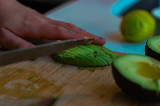 Perfectly cut avocado halves with knife